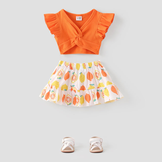 2pcs Baby Girl Solid Cotton Ribbed Ruffle - sleeve Twist Knot Crop Top and Allover Fruit Print Skirt Set - MomYom PK