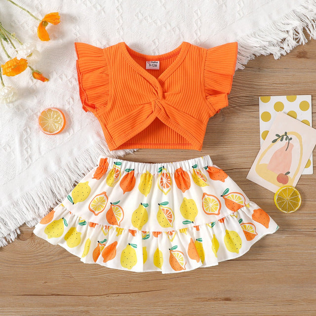 2pcs Baby Girl Solid Cotton Ribbed Ruffle - sleeve Twist Knot Crop Top and Allover Fruit Print Skirt Set - MomYom PK